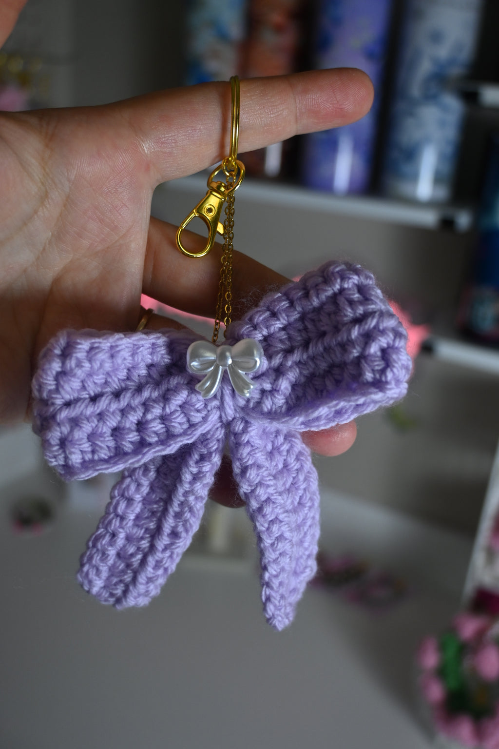 handmade purple crochet bow keychain on gold ring