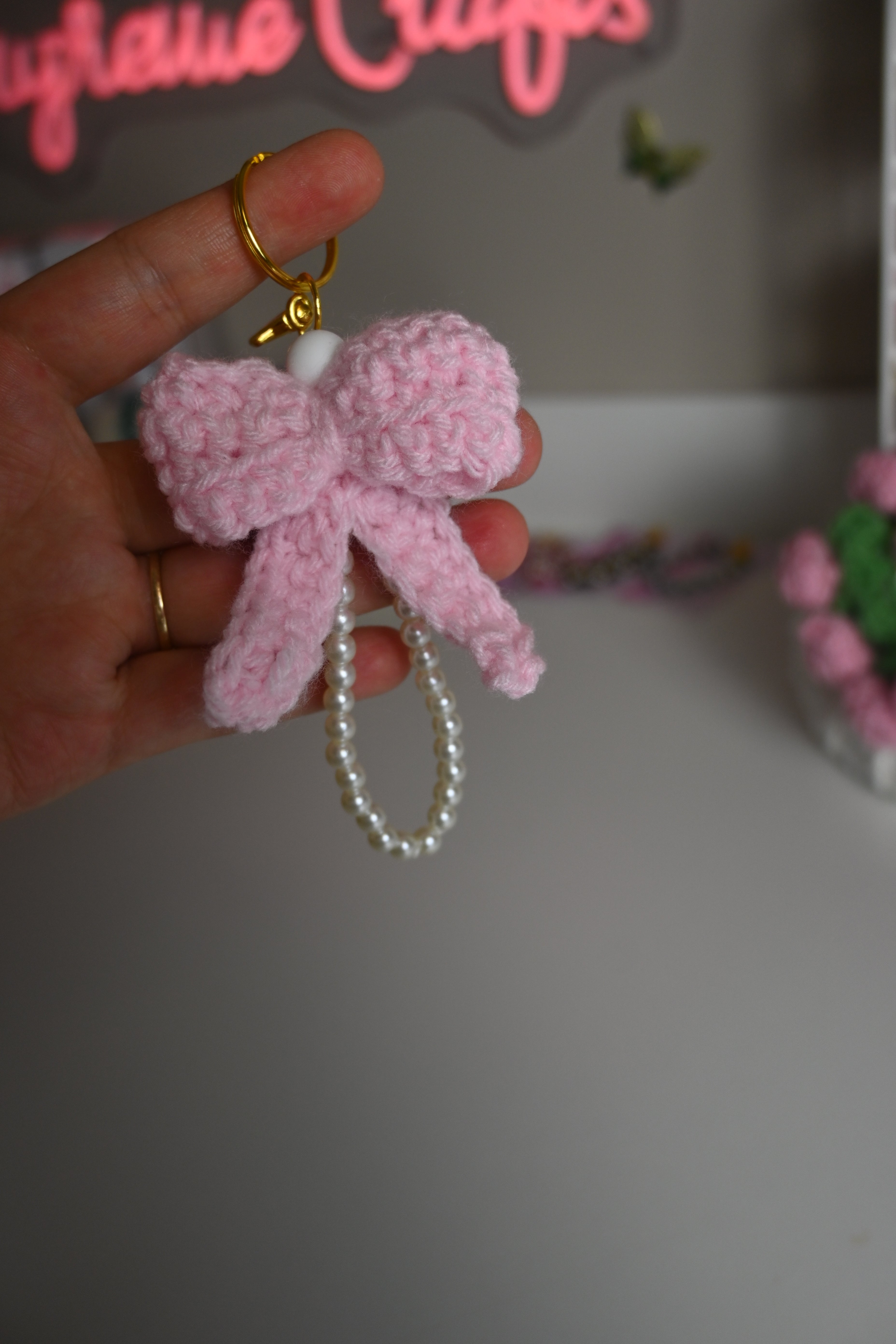 “handmade crochet pink bow keychain with pearl beads
