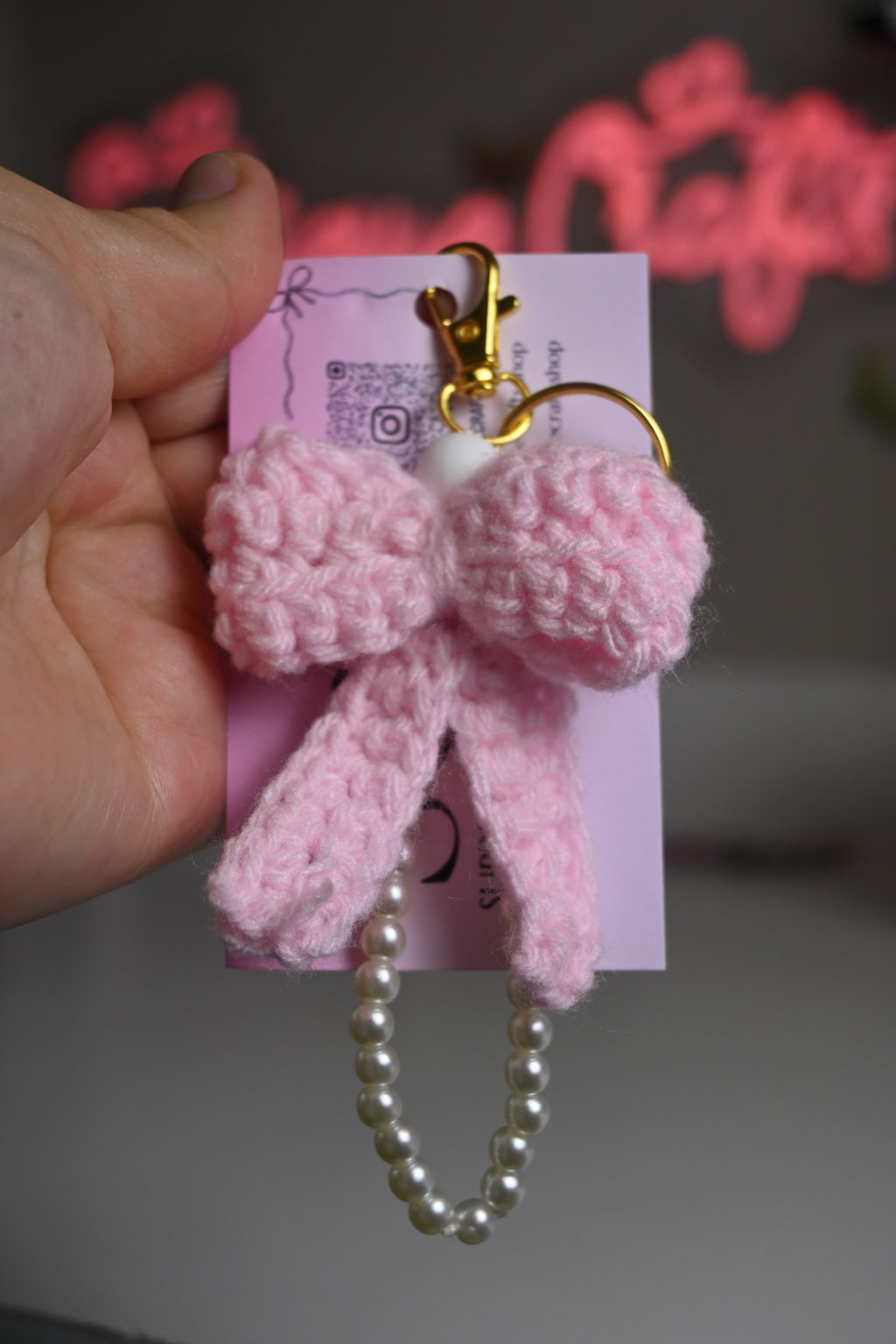 “handmade crochet pink bow keychain with pearl beads