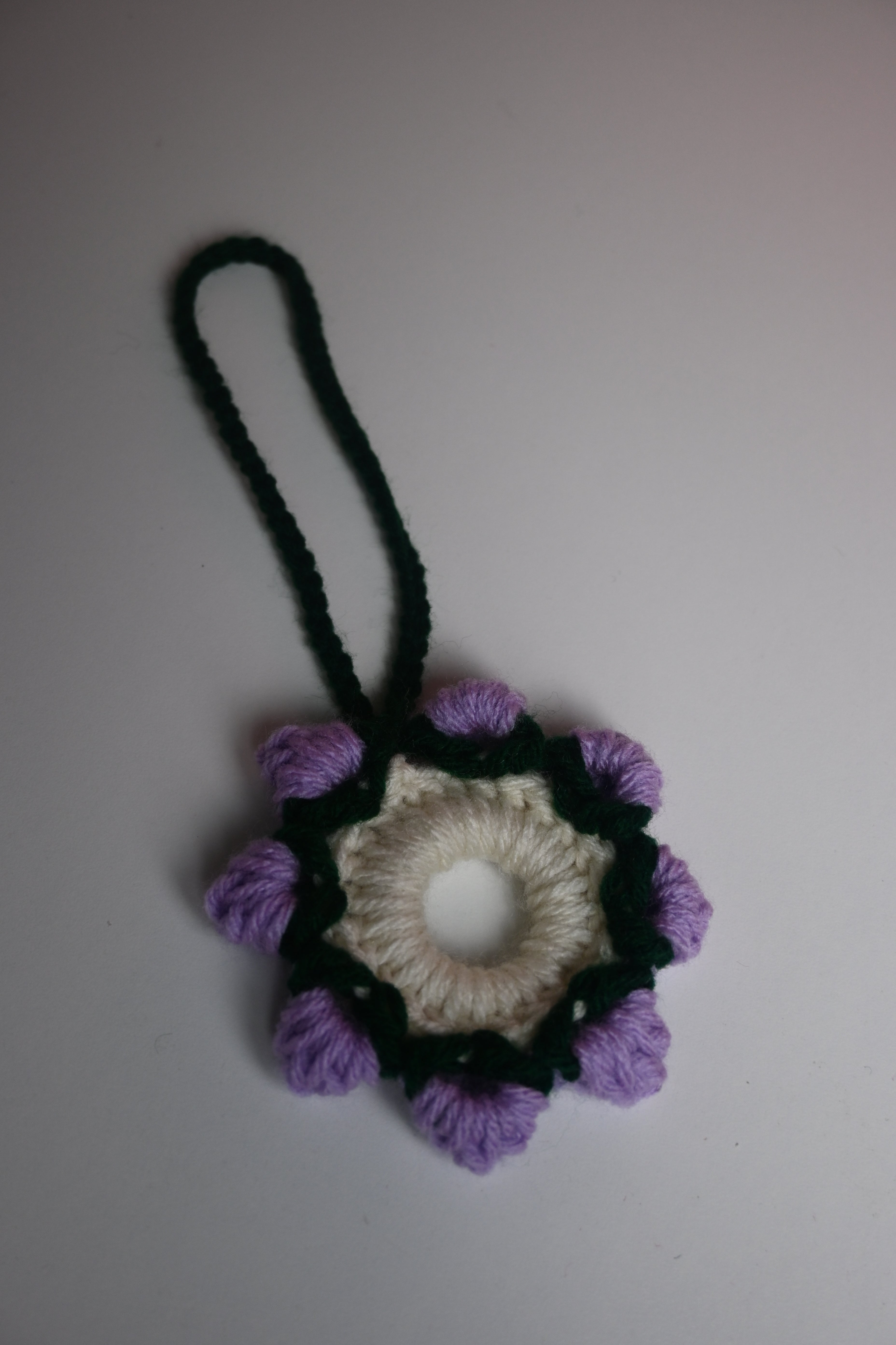 “Purple handmade crochet car accessory floral style”
